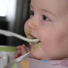 Baby eating solid food